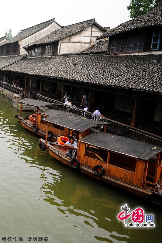 With a history of 1,200-year, Wuzhen is about one hour's drive from Hangzhou,the capital of Zhejiang Province.The small town is famous for the ancient buildings and old town layout, where bridges of all sizes cross the streams winding through the town. [China.org.cn]