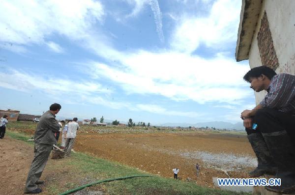 A reservior designed to hold 2.6 million cubic meters of water is seen in Zhaoyang District of Zhaotong City, southwest China&apos;s Yunnan Province, Aug. 23, 2011. A lingering drought has withered up almost 220,000 hectares of crops and dried up 15 rivers in Zhaotong, leaving at least 190,000 people and 28,000 livestock short of drinking water.