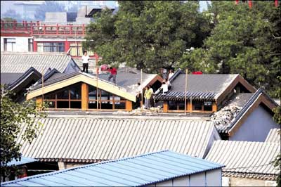 Workers dismantle controversial building. 