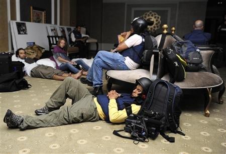 Members of the media gather in the basement at the Rixos hotel in Tripoli August 23, 2011.