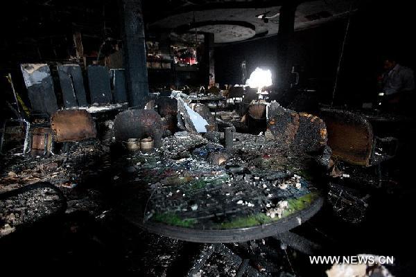 Photo taken on Aug. 26, 2011 shows remains inside the damaged Casino Royale in Monterrey, Mexico. An armed group broke into the packed Casino Royale, sprayed fuel and set fire, killing at least 53 people and leaving dozens of others injured on Thursday afternoon. [Xinhua/Pedro Mera] 