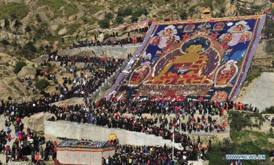 Photo taken on Aug. 29, 2011 shows an unfolded Sakyamuni Thangka painting at an unfolding ceremony during the Shoton Festival in Lhasa, capital of southwest China's Tibet Autonomous Region. The annual traditional Shoton Festival (Yoghurt Festival) kicked off here Monday.