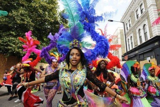 A performer takes part in the Notting Hill Carnival children's day in west London. London's police were out in force as the Notting Hill Carnival got under way Sunday in a bid to stop Europe's biggest street festival descending into a repeat of this month's devastating riots. [CNTV] 