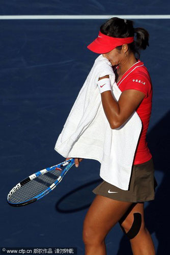 Na Li of China reacts to her loss against Simona Halep of Romania during Day Two of the 2011 US Open at the USTA Billie Jean King National Tennis Center on August 30, 2011 in the Flushing neighborhood of the Queens borough of New York City.