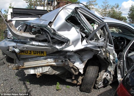 Totalled: Helen Menhinick's car was hit by four other vehicles - but she and her two sons escaped unhurt. [Agencies]