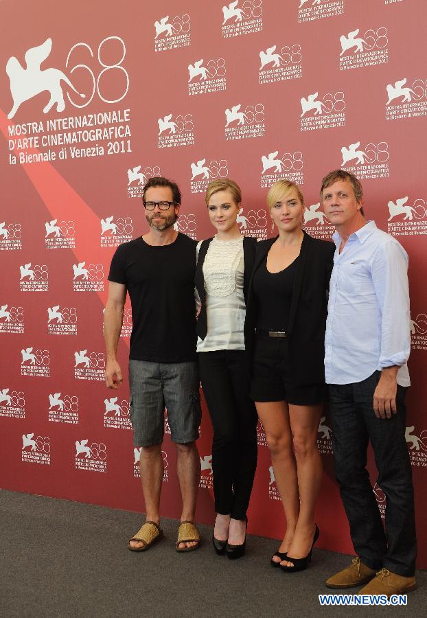  Director Todd Haynes (1st R) and cast members pose during the photo-call for the TV miniseries 'Mildred Pierce' at the 68th Venice Film Festival at Venice, Italy, Sept. 2, 2011. [Wang Qingqin/Xinhua]