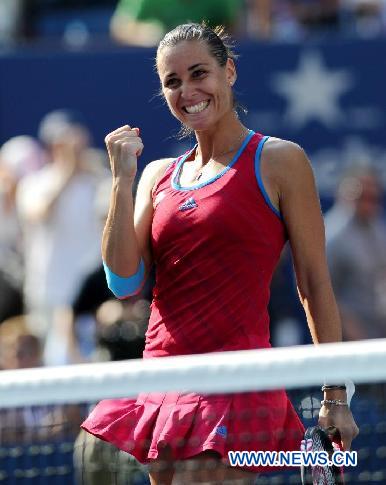 Flavia Pennetta of Italy gestures during the match against Maria Sharapova of Russia at the US Open tennis tournament in New York Sept. 2, 2011. Flavia Pennetta won 2-1. [Shen Hong/Xinhua]
