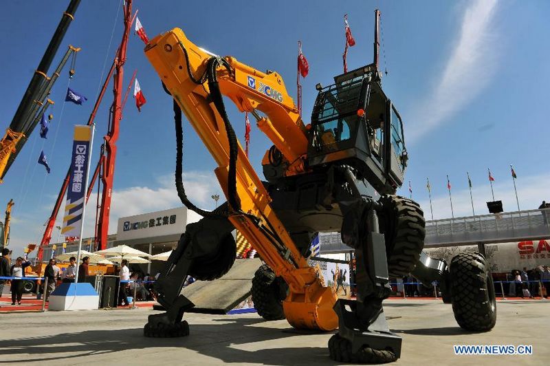 A gait-model shovel is seen during the ongoing China-Eurasia Expo in Urumqi, northwest China's Xinjiang Uygur Autonomous Region, Sept. 2, 2011. The all-terrain shovel, designed and made by China's leading heavy machinery maker XCMG, is equipped with 'walking wheels' which enable it to work under unfavorable circumstances like swamp and steep slope. [Xinhua/Jiang Wenyao] 