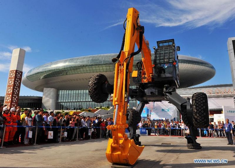 A gait-model shovel is seen during the ongoing China-Eurasia Expo in Urumqi, northwest China's Xinjiang Uygur Autonomous Region, Sept. 2, 2011. The all-terrain shovel, designed and made by China's leading heavy machinery maker XCMG, is equipped with 'walking wheels' which enable it to work under unfavorable circumstances like swamp and steep slope. [Xinhua/Jiang Wenyao] 