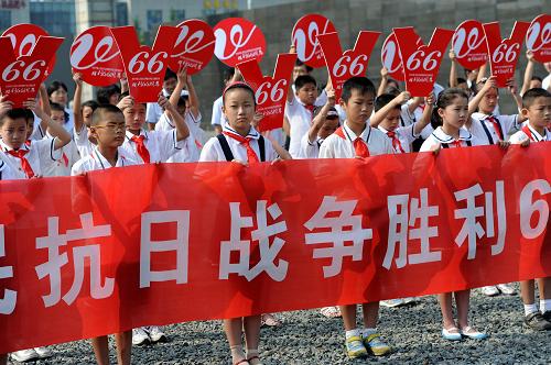 Primary school students attend a gathering to commemorate the 66th anniversary of China's victory against the Japanese at the Memorial Hall for the Victims of the Nanjing Massacre in Nanjing, capital of east China's Jiangsu Province, on Saturday, September 3, 2011. [Photo: Xinhua] 