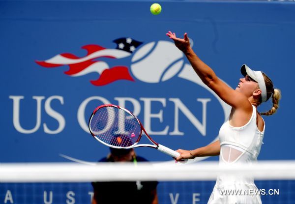 Caroline Wozniacki of Denmark serves to Vania King of the United States during the third round match of women's singles at US Open tennis tournament in New York, Sept. 3, 2011. Wozniacki won 2-0.