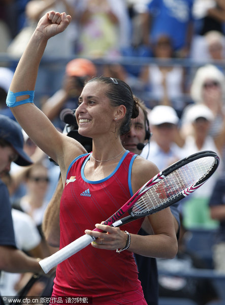 Flavia Pennetta of Italy reacts after her match against Peng Shuai of China during the U.S. Open tennis tournament in New York, Sunday, Sept. 4, 2011.