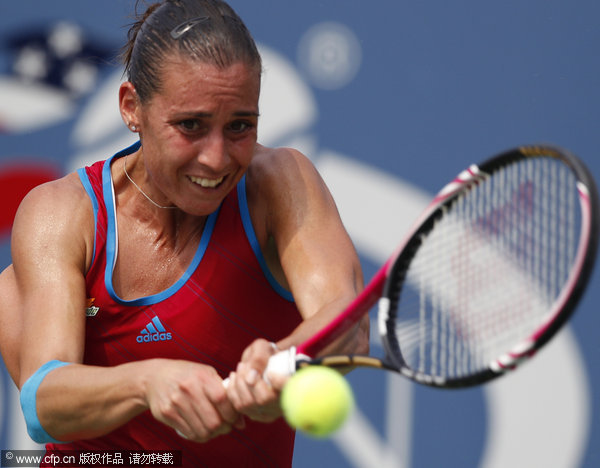 Flavia Pennetta of Italy returns a shot to Peng Shuai of China during the U.S. Open tennis tournament in New York, Sunday, Sept. 4, 2011.