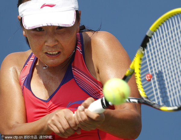 Peng Shuai of China returns a shot to Flavia Pennetta of Italy during the U.S. Open tennis tournament in New York, Sunday, Sept. 4, 2011.