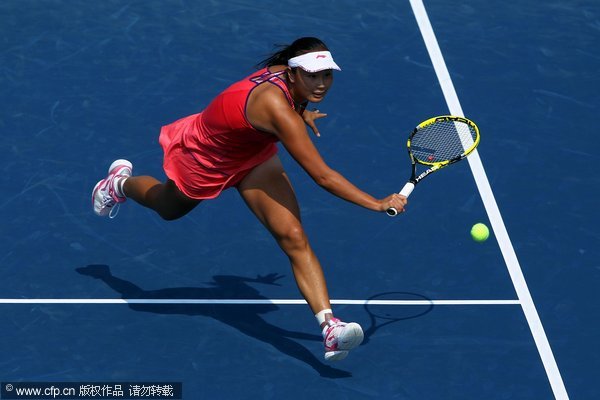 Shuai Peng of China returns a shot against Flavia Pennetta of Italy serves against during Day Seven of the 2011 US Open at the USTA Billie Jean King National Tennis Center on September 4, 2011