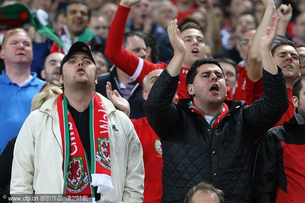 Wales' fans in the stands during the UEFA Euro 2012 Qualifying match at Wembley Stadium, London.