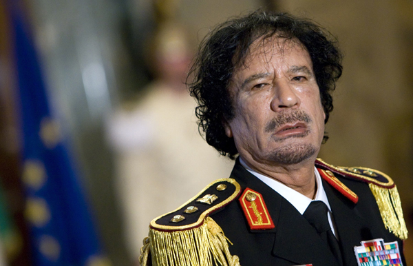 Libya's leader Muammar Gaddafi looks on during a news conference at the Quirinale palace in Rome in this June 10, 2009 file photo. [Xinhua]