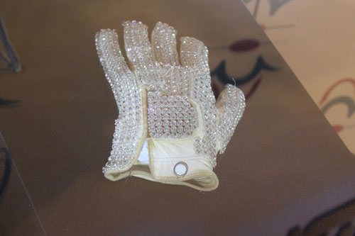 A rhinestone-covered glove that singer Michael Jackson wore is on display at the New World Department Store in Beijing Sept. 8, 2011.