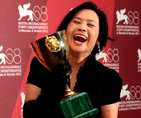 Actress Deanie Yip holds her Best Actress award for her role in A Simple Life, during the award ceremony of the 68th edition of the Venice Film Festival in Venice, Italy, Saturday, Sept. 10, 2011.