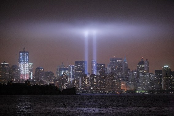 The Tribute in Light rises above the World Trade Center site and lower Manhattan, seen from Jersey City, the United States, Sept. 11, 2011. New York commemorated the 10th anniversary of the September 11 attacks on Sunday. [Zhu Wei/Xinhua]