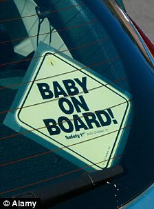 Baby on board sticker in car window