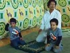Gadhafi home video shows him playing with kids
