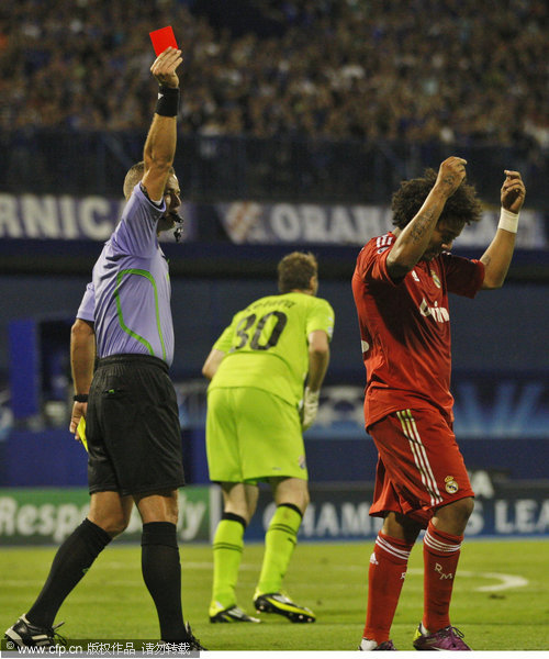 Real Madrid's Marcelo receives a red card during their Champions League Group D soccer match against Dinamo Zagreb at Maksimir stadium in Zagreb, Croatia, Wednesday, Sept. 14, 2011.