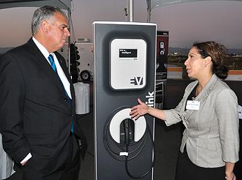 At the APEC meeting, U.S. Transportation Secretary Ray LaHood listens to Alana Chávez-Langdon, vice president of government relations and public affairs, ECOtality. [Environmental News Service] 