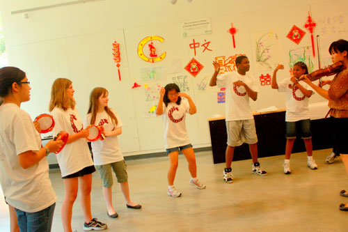 American students perform in Mandarin Chinese during a summer camp sponsored by the Confucius Institute of the George Mason University in August. Mandarin Chinese is becoming a more popular foreign language course being taught in some U.S. schools. 