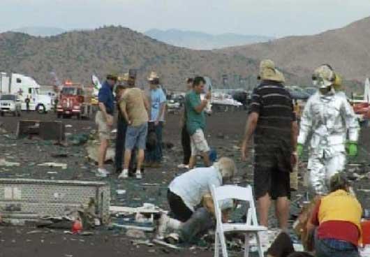 Rescuers and debris are seen after a P-51 Mustang airplane crashed at the Reno Air show on Friday, Sept. 16, 2011 in Reno Nev.. The plane plunged into the stands at the event in what an official described as a 'mass casualty situation.' [Xinhua]