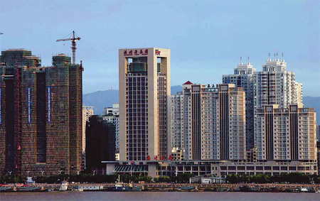 Real estate projects under construction in Wenzhou, Zhejiang province. Many local developers have turned to underground financing as China tightens bank lending policies. [China Daily]