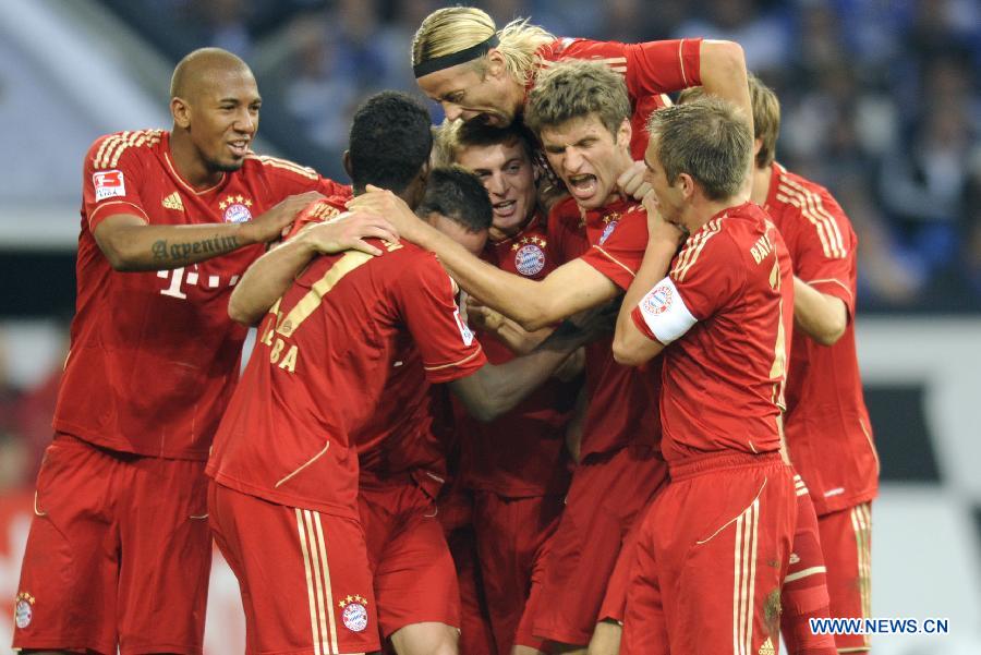 Players of Bayern Muenchen celebrate a goal during German Bundesliga football match between FC Schalke 04 and FC Bayern Muenchen in Gelsenkirchen, Germany, Sept. 18, 2011. FC Bayern won the match 2:0. [Xinhua/Uwe Kraft]