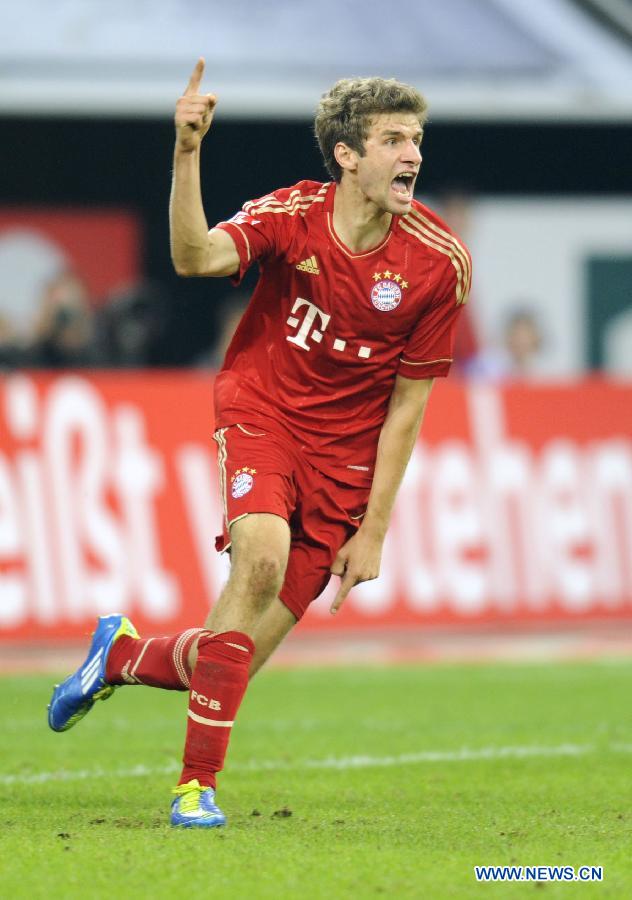 Thomas Mueller of Bayern Muenchen celebrates his goal during German Bundesliga football match between FC Schalke 04 and FC Bayern Muenchen in Gelsenkirchen, Germany, Sept. 18, 2011. FC Bayern won the match 2:0. [Xinhua/Uwe Kraft]