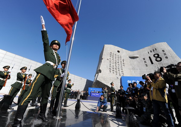 A flag-raising ceremony is held in front of the Sept 18 Museum in Shenyang, capital of Liaoning province, on Sunday. 