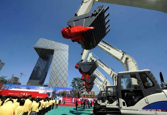 Photo taken on Sept. 19, 2011 shows the ceremony for the beginning of the construction of the city's tallest skycraper in Beijing, capital of China. Beijing will begin building the city's tallest skyscraper in its central business district. The 108-story 510-meter building, called 'China Zun', is shaped like a zun, an ancient Chinese wine vessel, and will be completed within five years. [Luo Xiaoguang/Xinhua]
