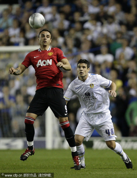 manchester united's dimitar berbatov, left, keeps the ball from leeds' darren o'dea during their english league cup third round soccer match at elland road stadium, leeds, england, tuesday sept. 20, 2011. 