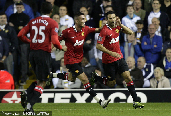 Manchester United's Ryan Giggs (right) celebrates after scoring against Leeds during their English League cup third round soccer match at Elland Road stadium, Leeds, England, Tuesday Sept. 20, 2011.