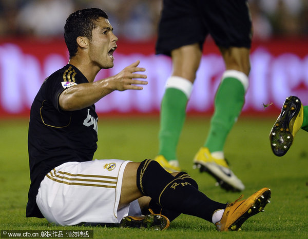 Real Madrid's Cristiano Ronaldo reacts during the La Liga soccer match against Racing Santander at the Sardinero Stadium in Santander on Wednesday Sept. 21, 2011.