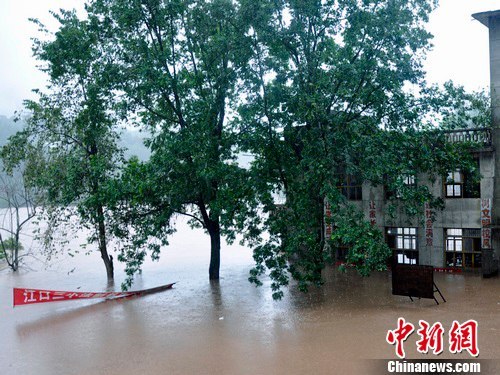 A school is submerged by rain-triggered flood in Pingchang, Sichuan Province, on Sept. 18. The highest flood peak in the history of the Qujiang River passed through southwest China's Sichuan Province on Sept. 21, leaving 25 people dead and 14 others missing.