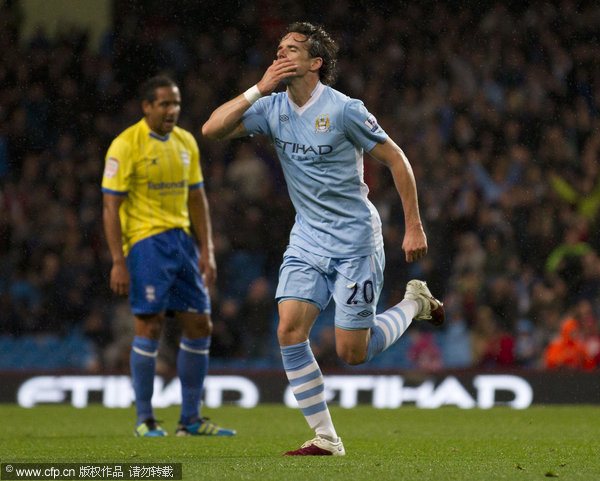 Manchester City's Owen Hargreaves celebrates after scoring against Birmingham during their English Premier League soccer match at the City of Manchester Stadium on Wednesday Sept. 21, 2011.