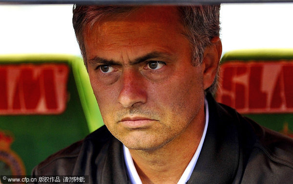 Real Madrid's coach Jose Mourinho reacts before a Spanish La Liga soccer match at the Sardinero Stadium in Santanter on Wednesday Sep 21, 2011.