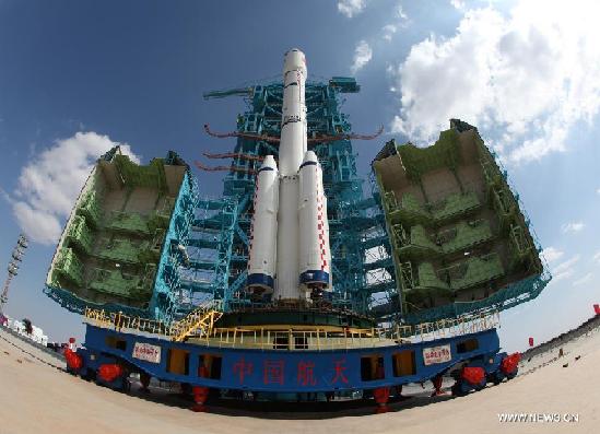 A Long March 2F carrier rocket loaded with 'Tiangong-1', China's unmanned space module, is moved to the launch pad at the Jiuquan Satellite Launch Center in northwest China's Gansu Province, Sept. 9, 2011. China will launch its unmanned space module, Tiangong-1, sometime from Sept. 27 to 30, a spokesperson said in Jiuquan Tuesday. [Xinhua]