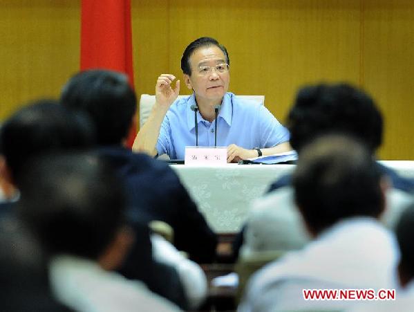 Chinese Premier Wen Jiabao addresses a national videophone conference on energy saving and emission cuts in Beijing, capital of China, Sept. 27, 2011.