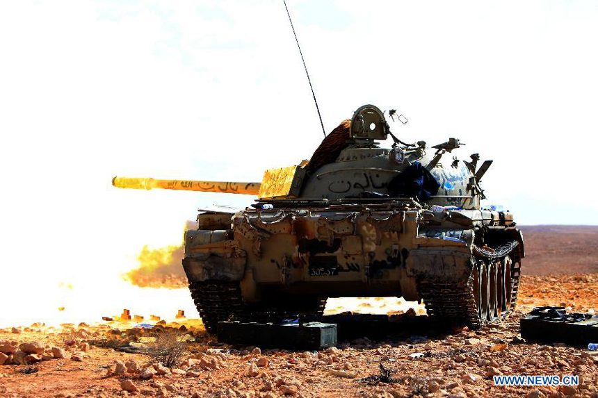 Forces of the Libyan National Transitional Council (NTC) shoot shells to the fighters loyal to Muammar Gaddafi outside Bani Walid, Libya, Sept. 27, 2011. Bani Walid is still occupied by fighters loyal to Muammar Gaddafi.