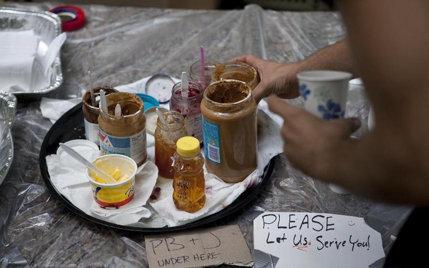 Some food is laid in a kitchen made by the protesters in preparation for the possible long-term demonstration in a park near the Wall Street in New York, the United States, on Sept. 27, 2011. After several streets around the Wall Street have been blockaded since Sept. 16, protesters pitched their tents at the Bowling Green and Battery Park to continue the demonstration. 