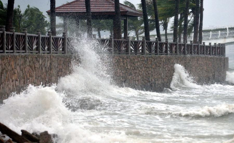 Photo taken on Sept. 29, 2011 shows strong wind blows trees in Sanya, south China's Hainan Province. Typhoon Nesat heads towards south China and is moving at an average wind speed of 20 km per hour toward the west coast of China's Guangdong Province.