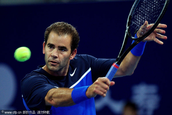 Sampras returns a ball during an exhibition match against Safin at China Open in Beijing on Friday, September 30, 2011.