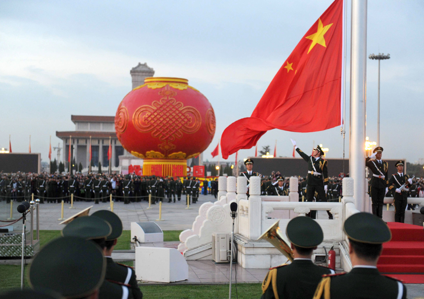 Chinese national flag is raised at the Tian&apos;anmen Square in Beijing, capital of China, Oct. 1, 2011. More than 120,000 people gathered at the Tian&apos;anmen Square to watch the national flag raising ceremony at dawn on Oct. 1, in celebration of the 62nd anniversary of the founding of the People&apos;s Republic of China.