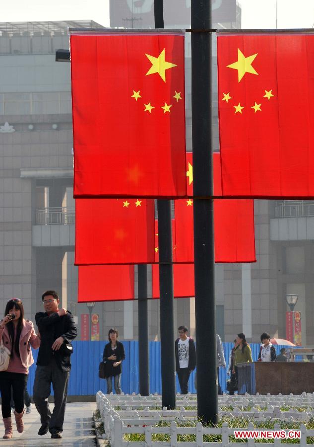 Photo taken on Sept. 30, 2011 shows the National Flags hung in streets in Jinan, capital of east China&apos;s Shandong Province, to celebrate the upcoming National Day on Oct. 1.