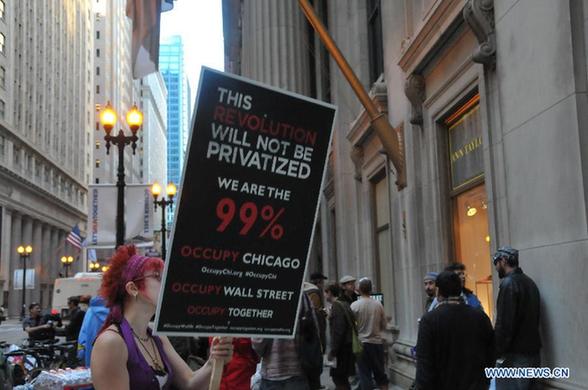Protestors take part in the 'Occupy Chicago' demonstration in Chicago's financial district on Oct. 3, 2011. The protest on Wall Street in New York against corporate greed spread out to Chicago, as the 'Occupy Chicago' demonstration entered its tenth day on Monday. [Zhang Baoping/Xinhua] 